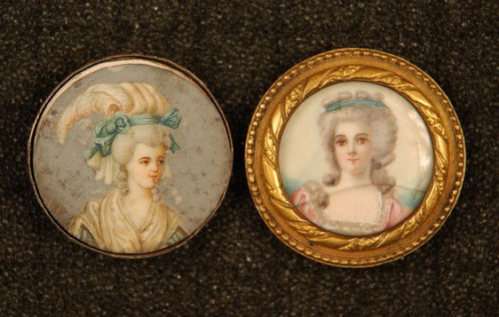 TWO UNDER GLASS BUTTONS, 18th C. Both large, with f: TWO UNDER GLASS BUTTONS, 18th C. Both large, with fine painting on ivory of lady in period costume with elaborate hair: One set in silver back with loop shank. 1 1/4. (Glass cover missing) painting an
