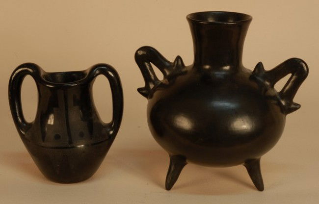 TWO NATIVE AMERICAN PUEBLO POTTERY VESSELS, 20th C: TWO NATIVE AMERICAN PUEBLO POTTERY VESSELS, 20th C. Probably San Ildefonso, both twin handled in polished black glaze: One tripod footed, undecorated, signed "Maria", 6 x 8. One with painted geometric