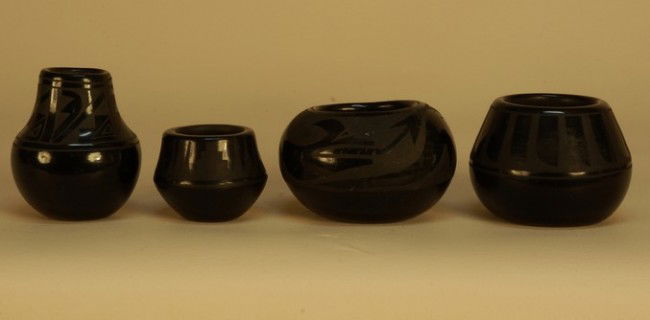 FOUR SAN ILDEFONSO and SANTA CLARA POTTERY VESSELS: FOUR SAN ILDEFONSO and SANTA CLARA POTTERY VESSELS, 20th C. One small with painted geometric design, signed "Blue Corn", 2 inches. Two with painted designs, indistinctly signed. One unsigned. Good-exc