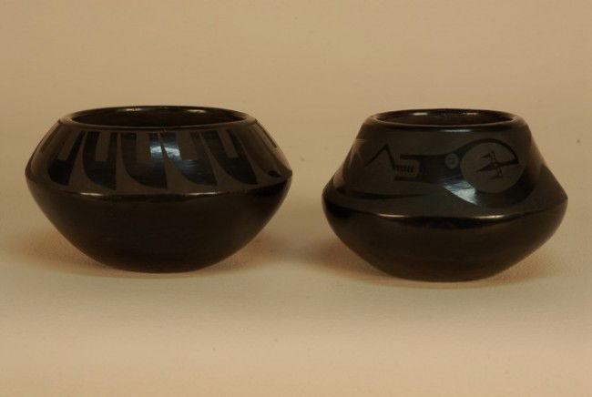 TWO SAN ILDEFONSO NATIVE AMERICAN POTTERY BOWLS 20: TWO SAN ILDEFONSO NATIVE AMERICAN POTTERY BOWLS 20th C. Both small with high polish black glaze: One having shoulder decoration of Avonyu, signed "Marie + Julian", 4 1/2 x 3 1/2. One decorated with ea