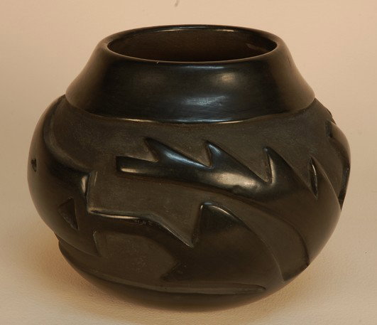 SANTA CLARA POTTERY JAR, 20th C. Heavily potted bu: SANTA CLARA POTTERY JAR, 20th C. Heavily potted bulbous jar with short neck in highly polished black, deeply carved with central "Avonyu" water serpent band. Signed "Helen". 8 x 7 1/2. Excellent.