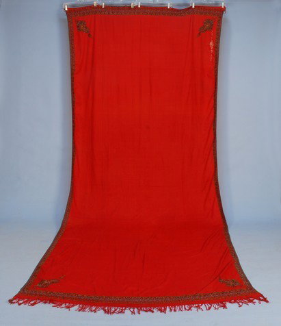 WOOL PAISLEY SHAWL, 19th C. Handmade Kashmir long : WOOL PAISLEY SHAWL, 19th C. Handmade Kashmir long rectangle with solid red field having boteh corners and narrow paisley band, elaborate signature. 62 x 132. (Few small holes). Very good.