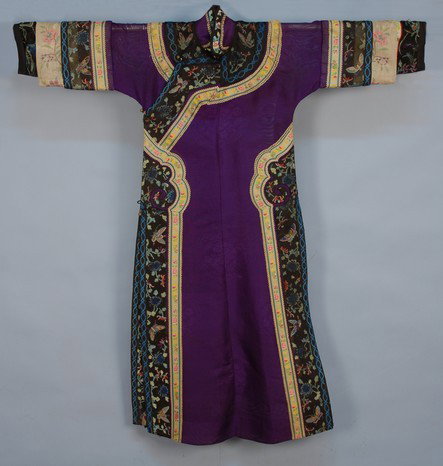 CHINESE MANCHU WOMAN'S ROBE, c. 1900. Summer weigh: CHINESE MANCHU WOMAN'S ROBE, c. 1900. Summer weight robe in purple silk gauze and white satin with ribbon applique and designs of peony and butterflies. Excellent.