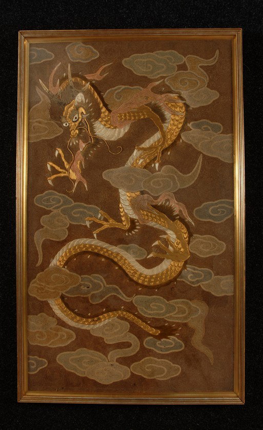 FRAMED JAPANESE EMBROIDERY of DRAGON, 19th-EARLY 2: FRAMED JAPANESE EMBROIDERY of DRAGON, 19th-EARLY 20th C. Couched and coiled silk ground decorated with bands of clouds and dragon worked in gold metallic and colored silk in gilt wooden frame. 46 x 28