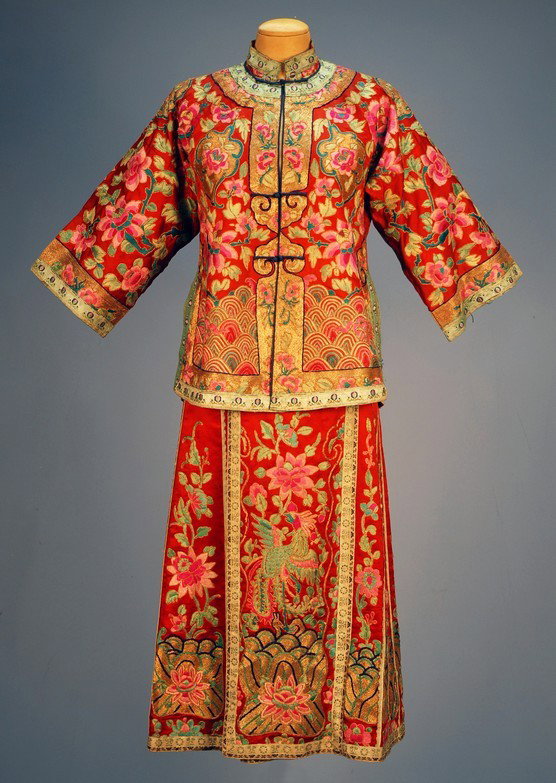 CHINESE WEDDING SKIRT and JACKET, MID 20th C. Red : CHINESE WEDDING SKIRT and JACKET, MID 20th C. Red silk satin jacket having allover embroidery in pink and green satin stitch and couched gold threads with flowers and wave border, the back with floral