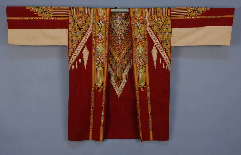 MOROCCAN TAPESTRY COAT 20th C. Colorful short open: MOROCCAN TAPESTRY COAT 20th C. Colorful short open coat executed in silk tapestry weave of geometric elements and stripes in yellow, white, red, green and black. 58 x 35. (Minor seam separation at sho