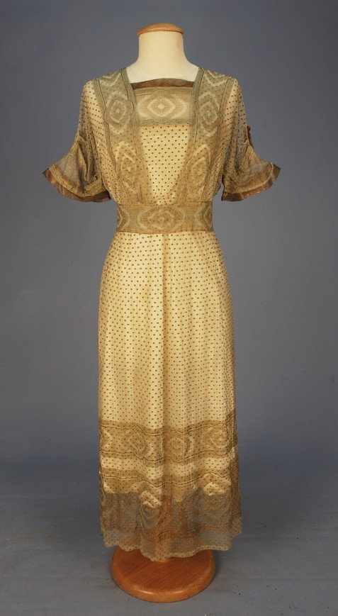 EDWARDIAN SUMMER DRESS with METALLIC GOLD EMBROIDE: EDWARDIAN SUMMER DRESS with METALLIC GOLD EMBROIDERY. Cream cotton net with short sleeve and square neck trimmed in gold lame, having allover raised gold dots and bands of lace-like stitching, no unde
