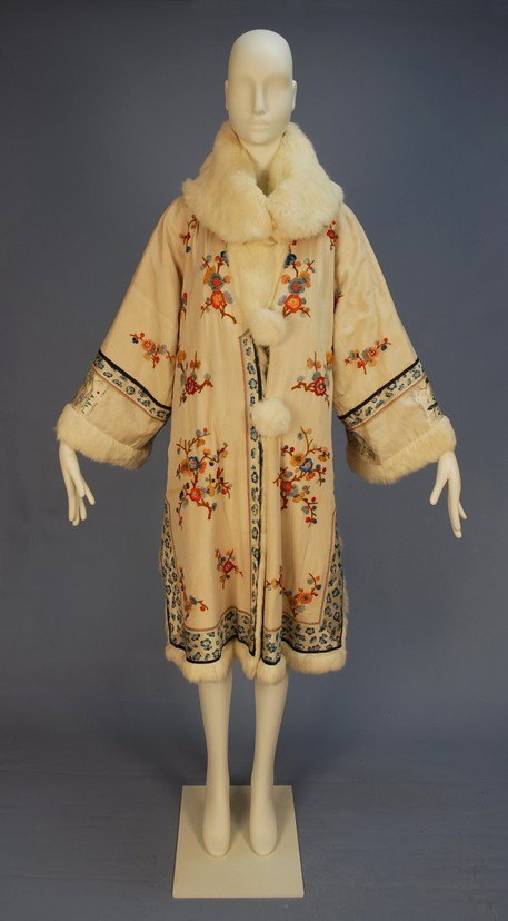 REVERSIBLE CHINESE EXPORT COAT with FUR LINING, MI: REVERSIBLE CHINESE EXPORT COAT with FUR LINING, MID 20th C. White silk embroidered with colorful flowering branches, blue and white trim bands, white rabbit fur shawl collar, cuff and buttons, side sl