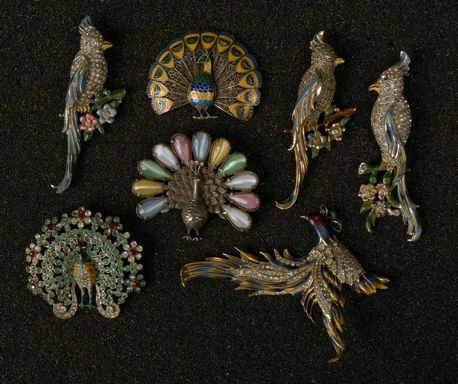 CORO STERLING and ENAMEL BIRD PIN, MID 20th C. Gol: CORO STERLING and ENAMEL BIRD PIN, MID 20th C. Gold over sterling fanciful bird with rhinestone sets, back marked "Coro Crafts Sterling", 2 3/4 x 3 3/4. Together with six bird pins having sets and/or