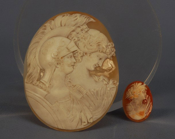 OVERSIZED UNMOUNTED ITALIAN SHELL CAMEO, EARLY 20t: OVERSIZED UNMOUNTED ITALIAN SHELL CAMEO, EARLY 20th C. Finely carved with classical busts of warrior and maiden in profile in white on shell pink, 4 1/2 x 3 1/2. Together with an unmounted shell cameo