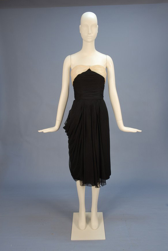 FRANK STARR SILK CHIFFON COCKTAIL DRESS, MID 20th : FRANK STARR SILK CHIFFON COCKTAIL DRESS, MID 20th C. Strapless black with ruched bodice having cream bandeau top, the narrow chiffon over silk skirt with chiffon swag and draping to right side, back z