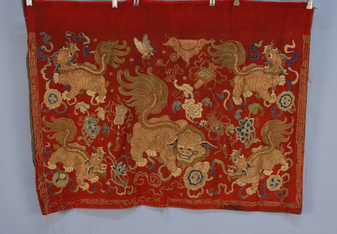 CHINESE EMBROIDERED PANEL, 19th C. Red wool with fiv: CHINESE EMBROIDERED PANEL, 19th C. Red wool with five Shi-Shi in couched metallic gold thread. 39 x 28. (Numerous loose threads) good.