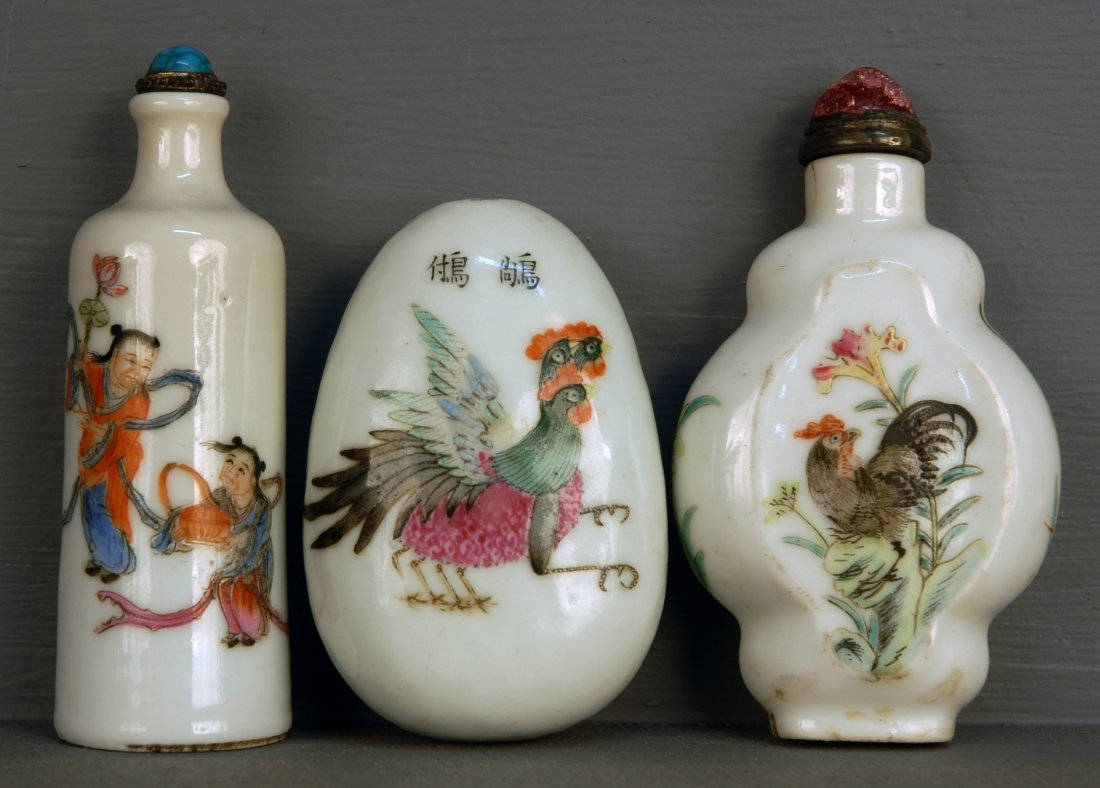 THREE CHINESE PORCELAIN SNUFF BOTTLES, 19th C. One: THREE CHINESE PORCELAIN SNUFF BOTTLES, 19th C. One egg shape with three headed chicken, figure and verse, (no stopper). One cartouche form with roosters. One shouldered bottle with Ho Ho figures.