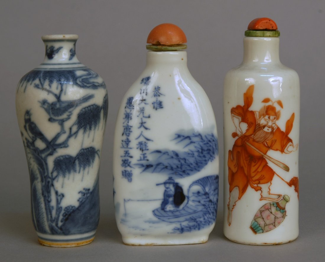 THREE CHINESE PORCELAIN SNUFF BOTTLES, 19th C. Two: THREE CHINESE PORCELAIN SNUFF BOTTLES, 19th C. Two blue and white glazed: One baluster vase form with birds, trees and rockwork (no stopper). One flattened vase form with deer, eagle, fisherman and ve