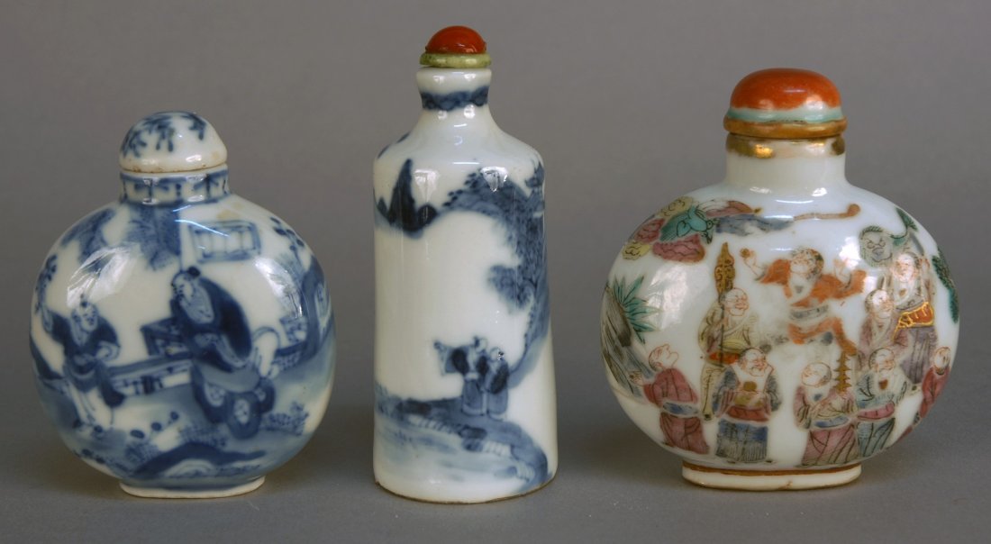 THREE CHINESE PORCELAIN SNUFF BOTTLES, 19th C. One : THREE CHINESE PORCELAIN SNUFF BOTTLES, 19th C. One bulbous form blue and white with figures in landscape and original porcelain stopper, Yongzheng four character mark. One polychrome bulbous with figu