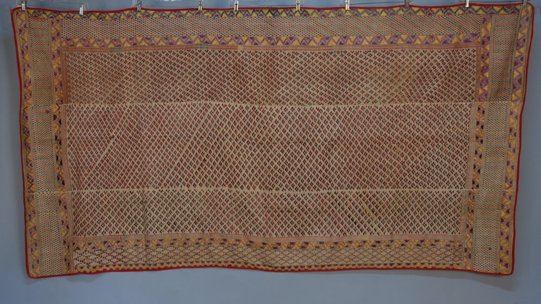 INDIAN EMBROIDERED BED COVER, 20th C. Silk embroid: INDIAN EMBROIDERED BED COVER, 20th C. Silk embroidery on cotton, border and guard border arrangement around overall repeating triangular motifs on red and green. 50 x 100. Together with four narrow un