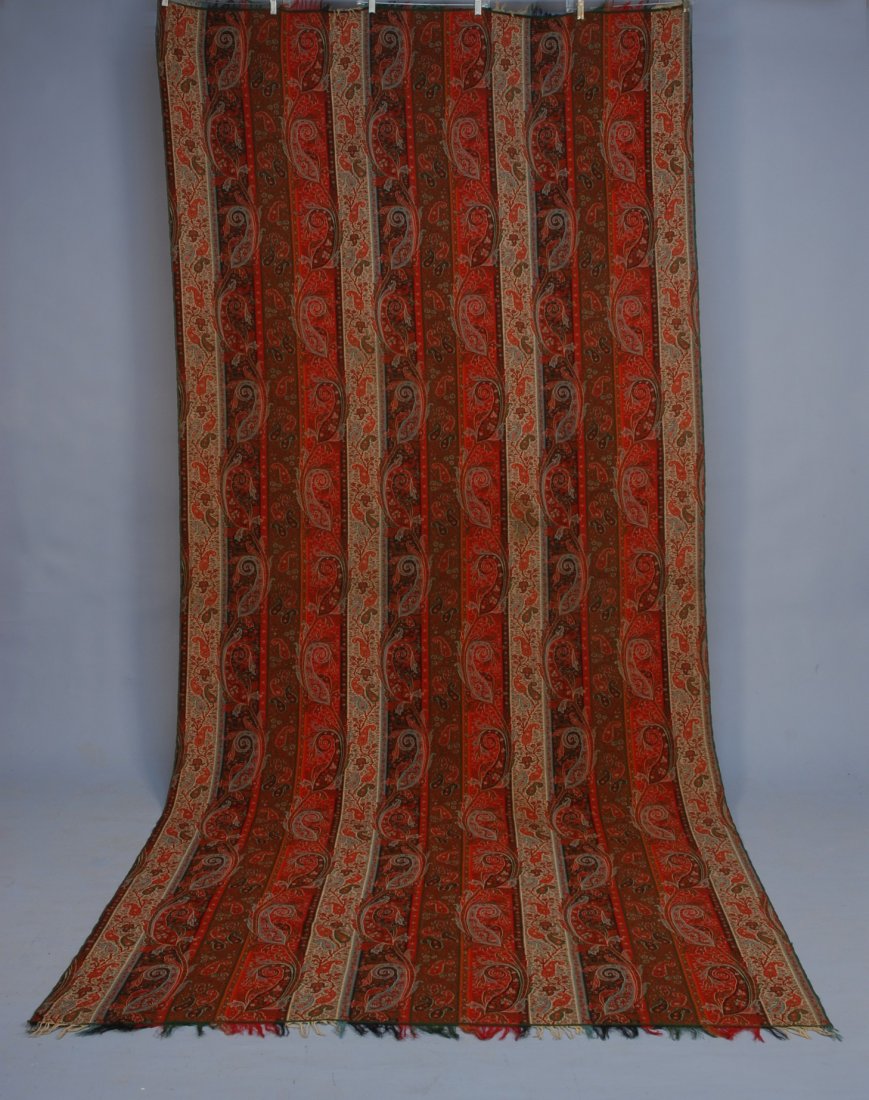 WOOL PAISLEY LONG SHAWL, 19th C. Vertical stripe i: WOOL PAISLEY LONG SHAWL, 19th C. Vertical stripe in an alternating pattern of large and small botehs. 120 x 56. (one tiny hole) excellent.