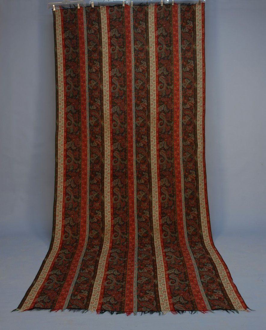 WOOL PAISLEY LONG SHAWL, 19th C. Striped rectangle: WOOL PAISLEY LONG SHAWL, 19th C. Striped rectangle with palette of black, green, white and red. 55 x 120. Excellent.