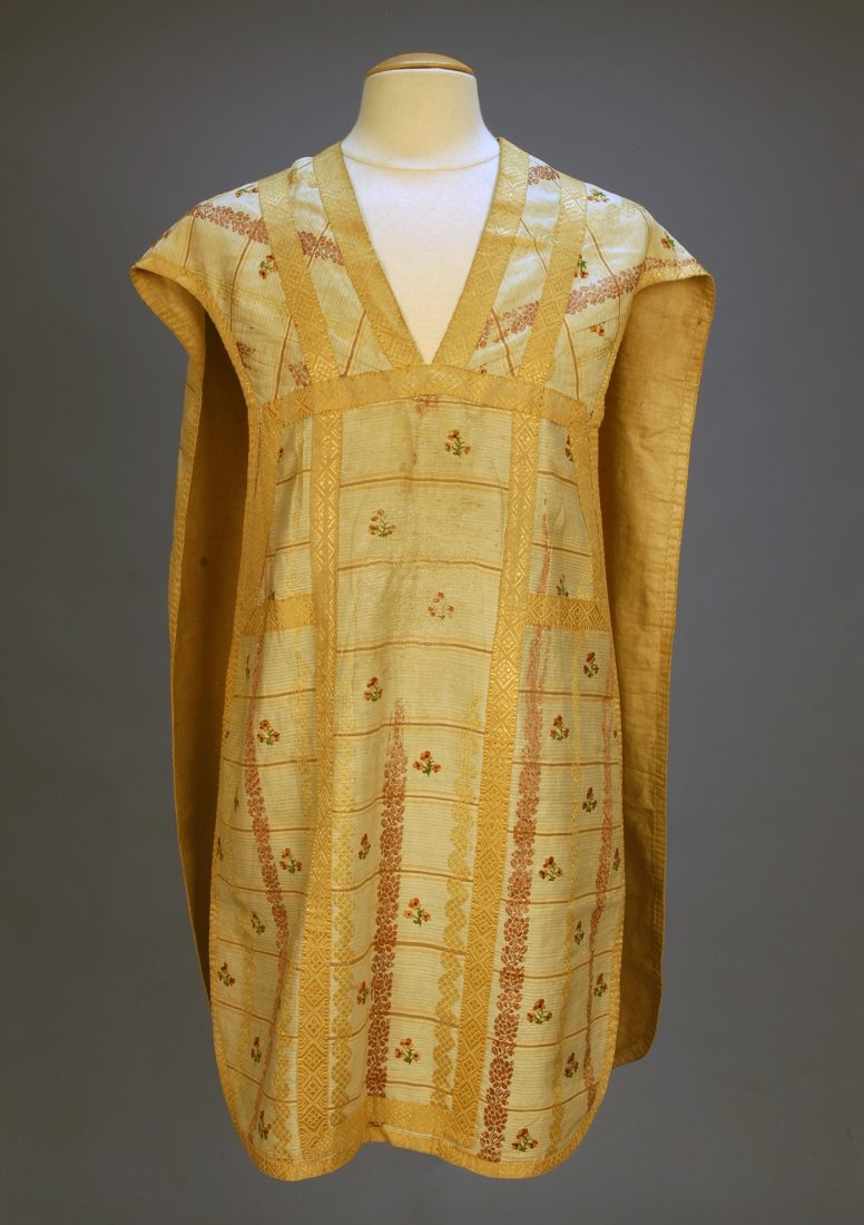 SILK BROCADE and EMBROIDERED CHASUBLE, 18th C. Cre: SILK BROCADE and EMBROIDERED CHASUBLE, 18th C. Cream silk having a woven stripe in pale blue, pink and mauve with dusty rose floral and ivory diamond brocade bands with a repeat of embroidered naive p