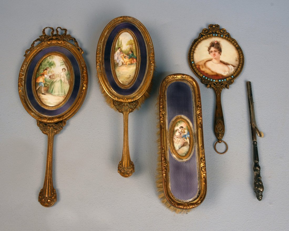 FRENCH VANITY SET with HAND PAINTED INSETS, EARLY: FRENCH VANITY SET with HAND PAINTED INSETS, EARLY 20th C. Bronze and enamel mirror, hairbrush and clothes brush inset with signed paintings of courting scenes. Mirror 11 1/4 x 4 1/4. (Brushes loose in