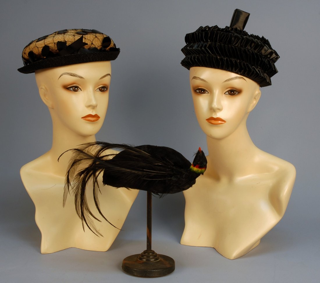 TWO PARIS DESIGNER HATS, MID 20th C. Christian Dio: TWO PARIS DESIGNER HATS, MID 20th C. Christian Dior black folded straw in six rings with squared topknot. Schiaparelli natural straw with black turned up brim, the crown covered in wide black net and