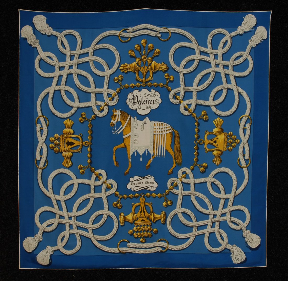 HERMES "PALEFROI" PRINTED SILK TWILL SCARF, 1966 D: HERMES "PALEFROI" PRINTED SILK TWILL SCARF, 1966 DESIGN. Black, gold and white, depicting horse and equestrian hardwear, signed F. de LA PERRIERE, "Hermes Paris" within design. 34 x 34 1/2 excellent.
