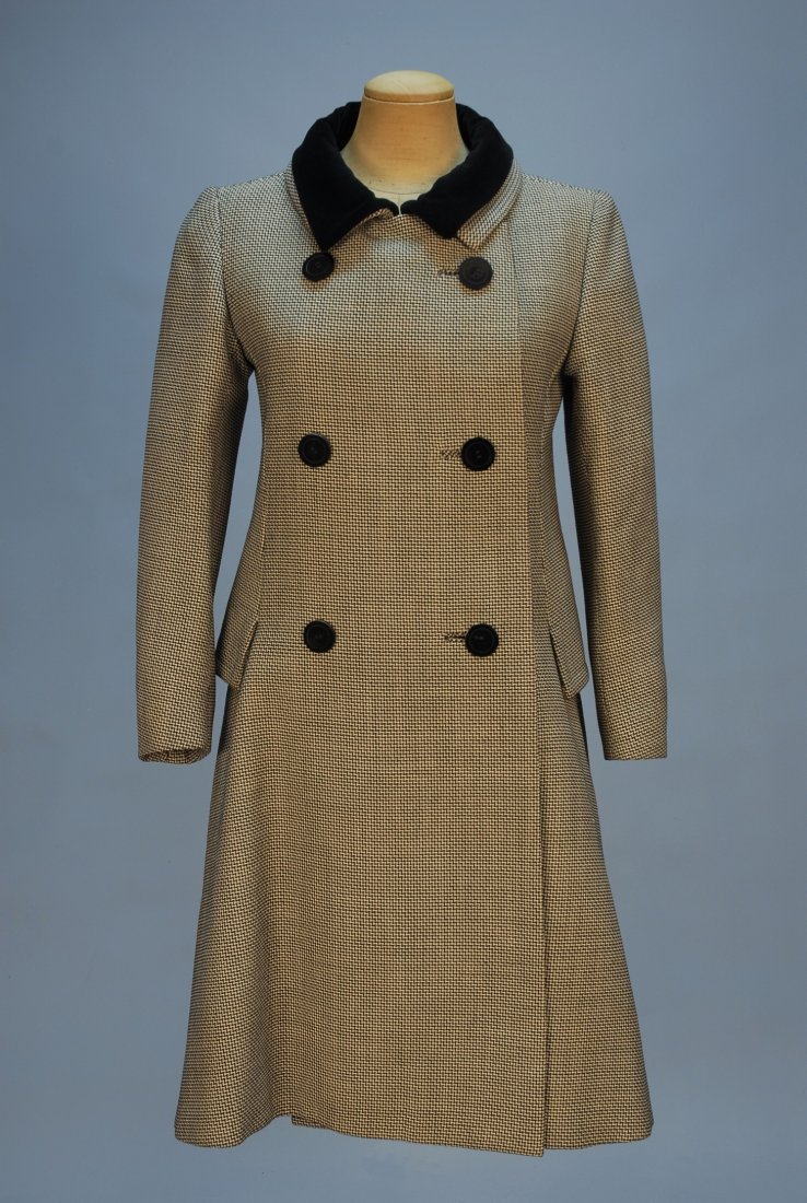 FABIANI DOUBLE BREASTED WOOL COAT, MID 20th C. A-l: FABIANI DOUBLE BREASTED WOOL COAT, MID 20th C. A-line in black and white tiny zig-zag weave with black velvet free standing collar over the wool collar, black buttons, faux pocket flap side panel over