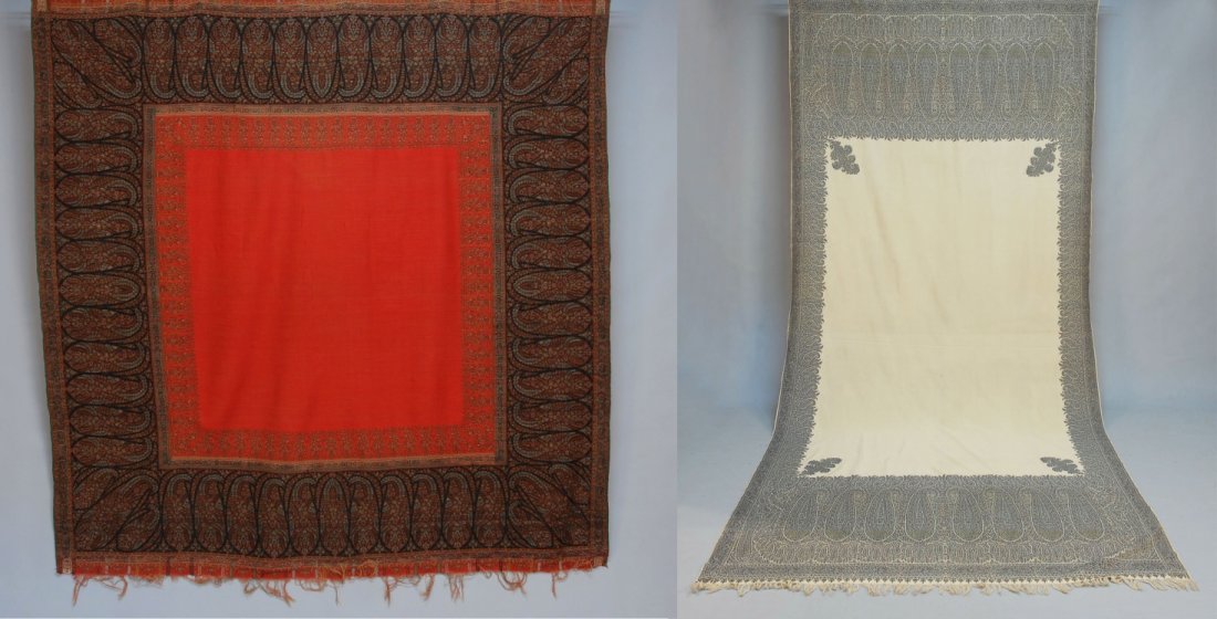 TWO PAISLEY SHAWLS, 19th C.: One cream, blue and red long paisley with large open field. 132 x 61. (Few small moth holes in field) good. One square paisley with open red field. 66 x 68. Excellent.