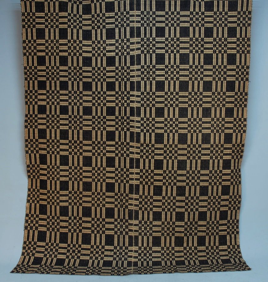 AMERICAN OVERSHOT COVERLET, 19th C.: Op-art style design woven in two sections in a blue and white repeating block design. 90 x 68. SM. Excellent.