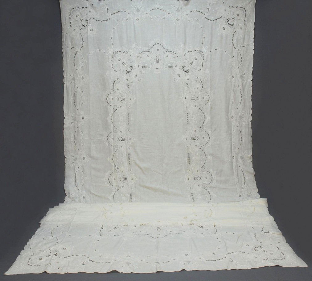 LINEN BANQUET CLOTH with CUTWORK and EMBROIDERY, E: Having border and interior band with embroidered floral, cutwork and pulled thread fillings. 86 x 238 (few small stains) very good.
