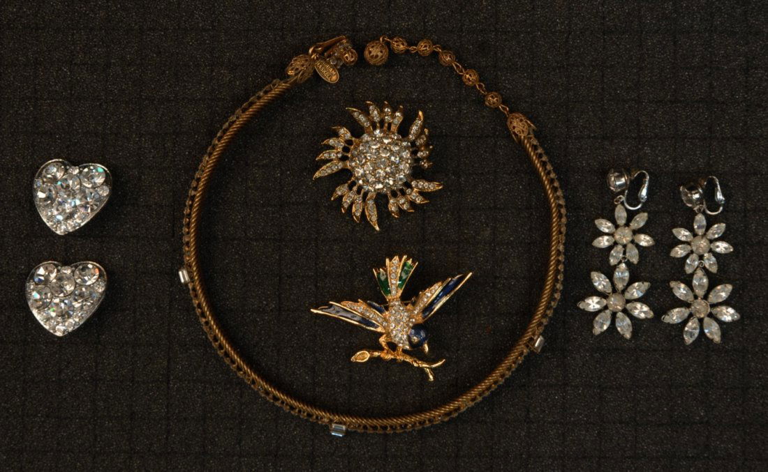 MIRIAM HASKELL RHINESTONE CHOKER, 1950's.: Narrow gilt metal dog collar with emerald cut rhinestones and filigree, "Miriam Haskell" marked on drop and tag. (Clasp missing loop) good. Together with two vintage rhinestone pins and two pair earri