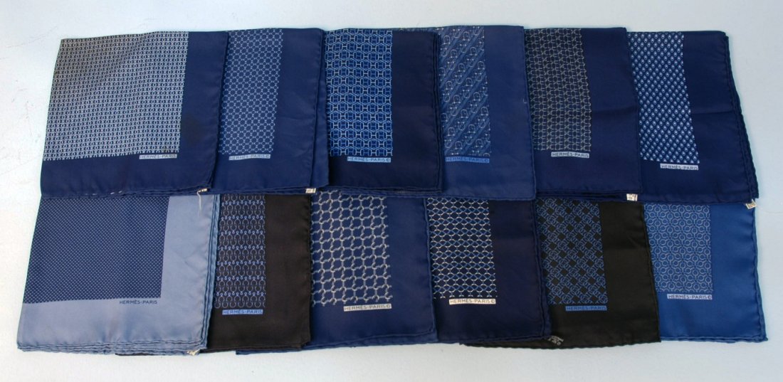 TWELVE HERMES PRINTED SILK POCKET SQUARES, 20th C.: Various classic patterns in mostly blues and black. Good-excellent.