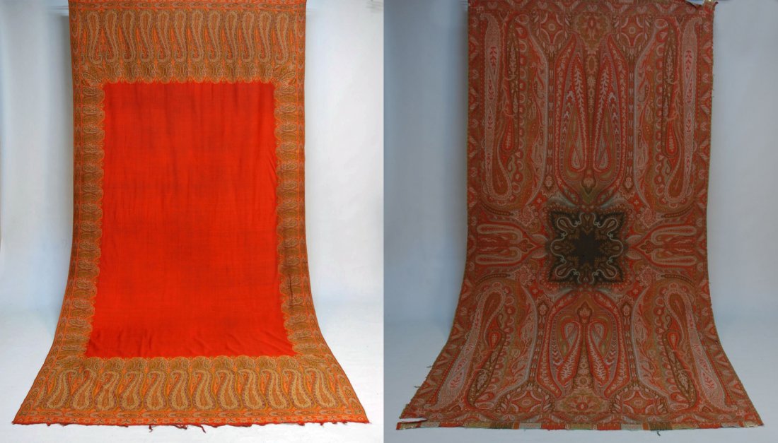 TWO PAISLEY SHAWLS, 19th C.: Both long paisleys: One red open field. 124 x 64. One lobed square, black decorated center. 124 x 62. (Both several holes) fair.