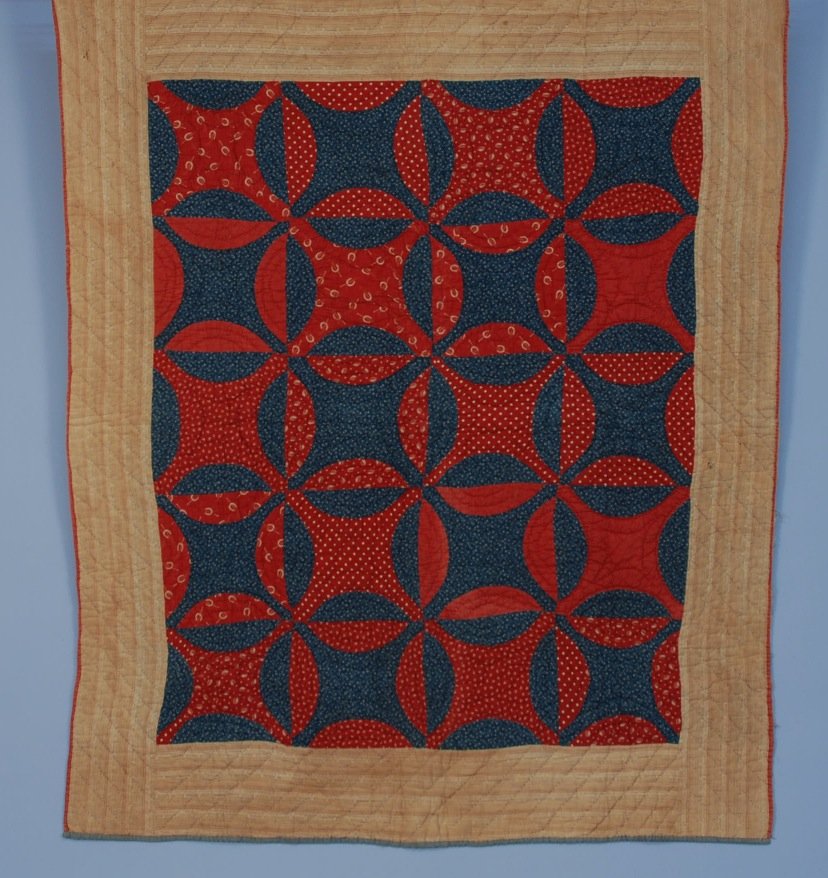 PIECED COTTON QUILT, 19th C.: Robbing Peter to Pay Paul design in turkey red calicos and indigos c. 1870, homespun border and verso. 69 x 56. Excellent.