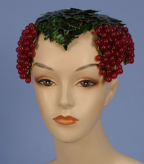 BES-BEN HOLLY HAT, 1940's.: Lacquered leaf shapes and red berry clusters on a velvet trimmed mesh foundation. Labeled. (Few leaves on the edge bent) very good.