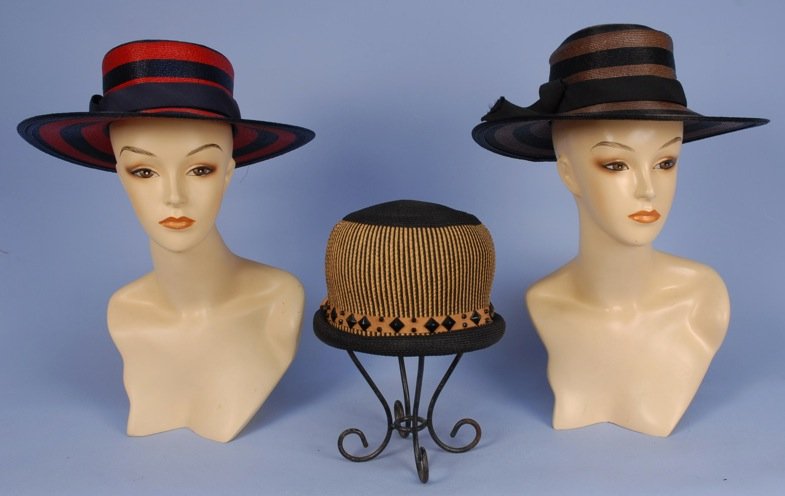 THREE STRAW HATS with FAILLE RIBBON, 1950's.: Two striped Bergdorf Goodman wide brim: One navy and red, one black and brown. One black and natural toque with studded ribbon. Excellent. MMA.