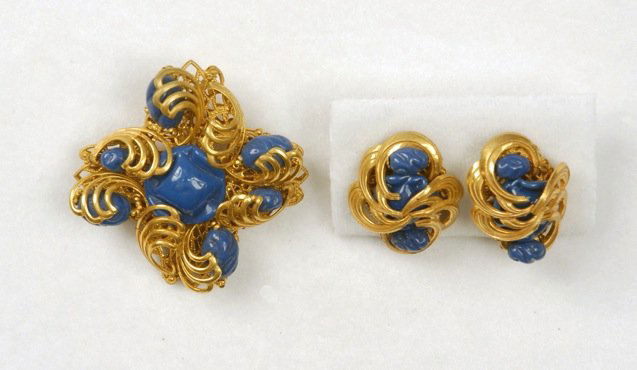 MIRIAM HASKELL PIN and EARRINGS.: Square form pin comprised of swirling "C" scrolls enclosing opaque blue art glass beads with very similar ear clips. Signed. Pin 2 x 2 inches. Excellent.