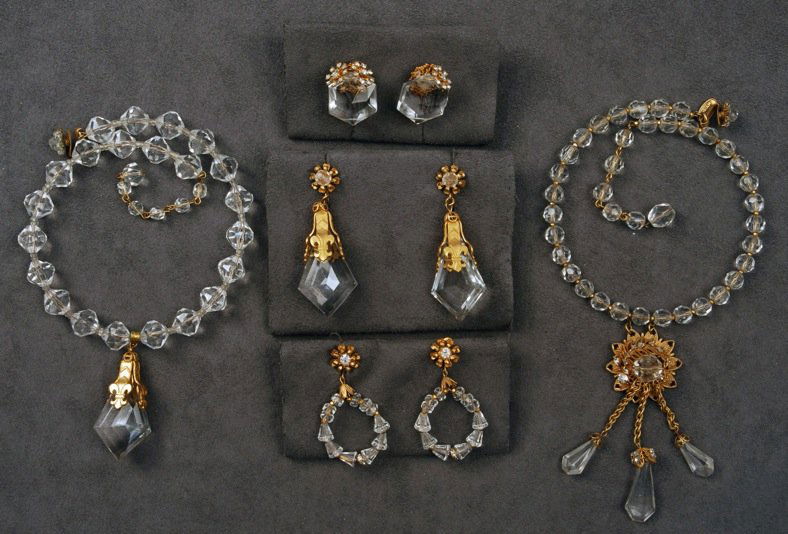 MIRIAM HASKELL NECKLACE and EARRING SET.: Crystal bead memory wire choker having large pendant crystal and matching ear clips. Together with a memory wire choker with girandole pendant and two pair similar ear clips. Five pieces. Signed. Exce
