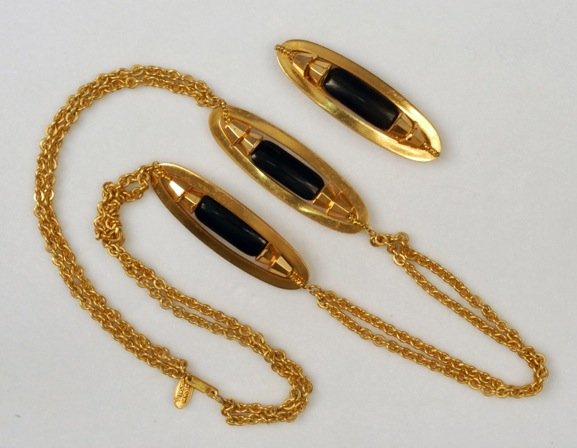 MIRIAM HASKELL MODERNIST NECKLACE and PIN.: Double gilt link chain separated by two flat oval rings, each suspending a black glass bar mounted between double chamfered cones, matching bar pin. Signed. Necklace 13 3/4 inches, pin 2 1/4 inches. E