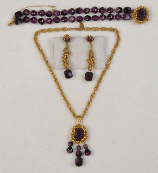 MIRIAM HASKELL DEMI PARURE.: All pieces gilt links and purple glass beads: Necklace with girandole style pendant, double strand beaded bracelet with matching clasp and drop ear clips. Signed. Necklace 9 3/4 inches. Excellent.