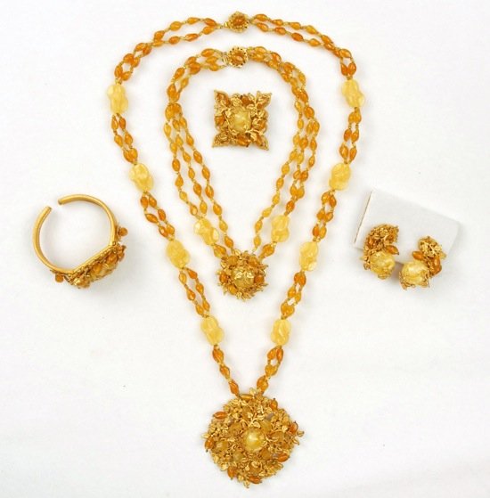 MIRIAM HASKELL FIVE PIECE PARURE.: Butterscotch bead and art glass necklace having large circular pendant with gilt leaf findings and art glass beads, 16 inches, multi-strand necklace with matching medallion, clamp bracelet, pin and ea