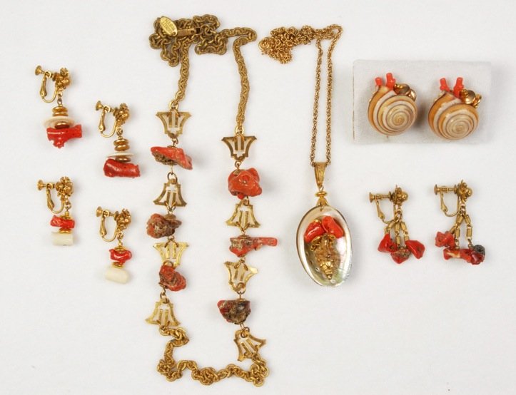 LOT of MIRIAM HASKELL CORAL JEWELRY.: All gilt metal with natural shaped coral pieces consisting of chain necklace, three pair drop ear clips and pendant necklace with coral and gilt shell set within natural shell. Together with a pair of