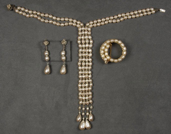 THREE PIECES MIRIAM HASKELL BAROQUE PEARL JEWELRY.: Bib necklace and ear clips with teardrop pendant both having silvered findings. Memory wire cuff bracelet with gilt findings. Signed. Necklace 16 inches. Good to excellent.
