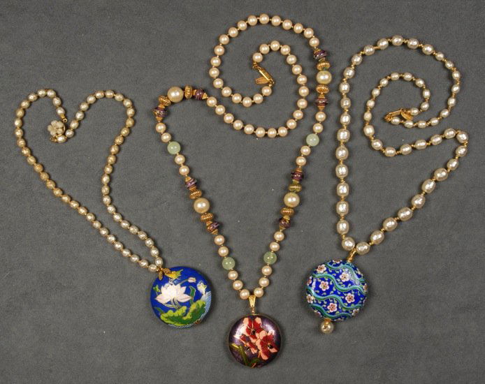 THREE MIRIAM HASKELL NECKLACES with CLOISONNE PENDANT.: All pearl strands, one having separators of art glass and gilt beads, all with floral cloisonne pendant. Signed. 11 1/2 - 17 1/2 inches. Good-excellent.