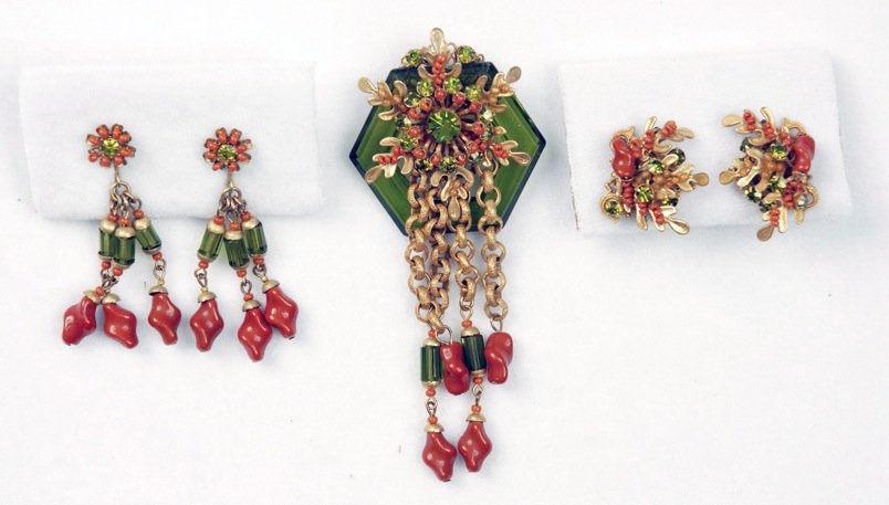MIRIAM HASKELL THREE PIECE PIN and EARRING SET, 1969.: Hexagonal green plastic pin mounted with oak leaf findings, coral beads, rhinestones and chain drops with glass beads and coral color art glass, two pair matching earrings. Signed. Identical pin pictu