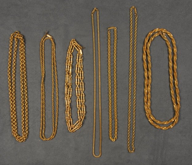 SEVEN MIRIAM HASKELL CHAIN NECKLACES.: Variform gilt links. Signed. 9 1/2 - 18 1/4 inches. Good-excellent.