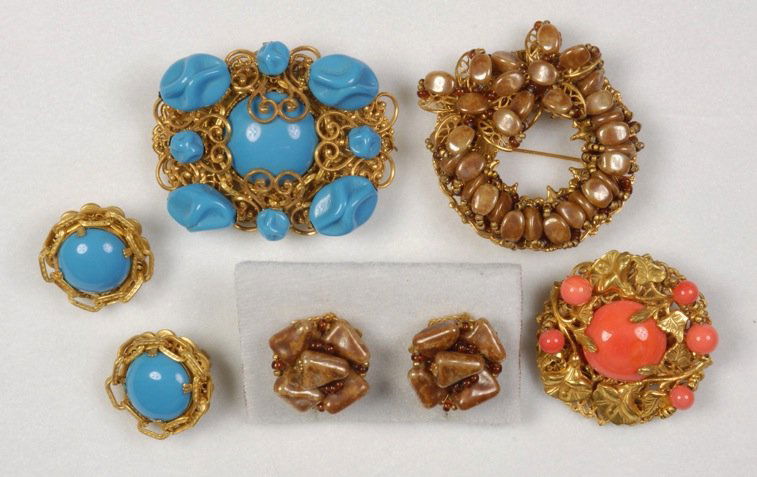 THREE MIRIAM HASKELL PINS.: All gilt filigree and metal stampings, one circle with brown beads and matching earrings, one having salmon cabochon and beads, one with turquoise cabochon and ruffled beads with a pair of similar ear