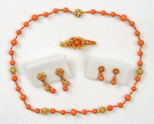 MIRIAM HASKELL THREE PIECE DEMI PARURE.: Coral colored glass bead necklace with filigree ball and rondelle separations, matching pin and ear clips. Signed. Necklace 13 inches. Excellent.