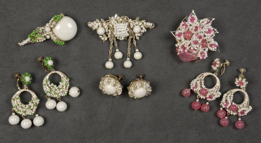 THREE MIRIAM HASKELL PIN and EARRING SETS.: All having silvered filigree, seed and larger beads, one pink, one white, one green. Signed. Largest pin 2 1/2 inches. Good-excellent.