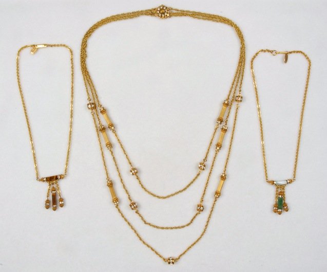 THREE MIRIAM HASKELL NECKLACES.: All gilt chains with bar spacers and rhinestone rondelles, one triple strand with fluted bars, two girandole style in faux jade, and faux tiger's eye. Signed. Necklaces 8 - 14 1/2 inches. Excellent.